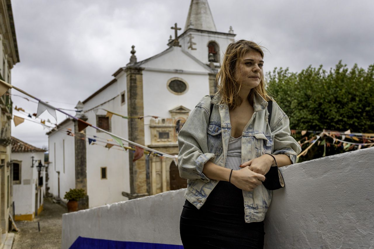 Woman standing in front of building