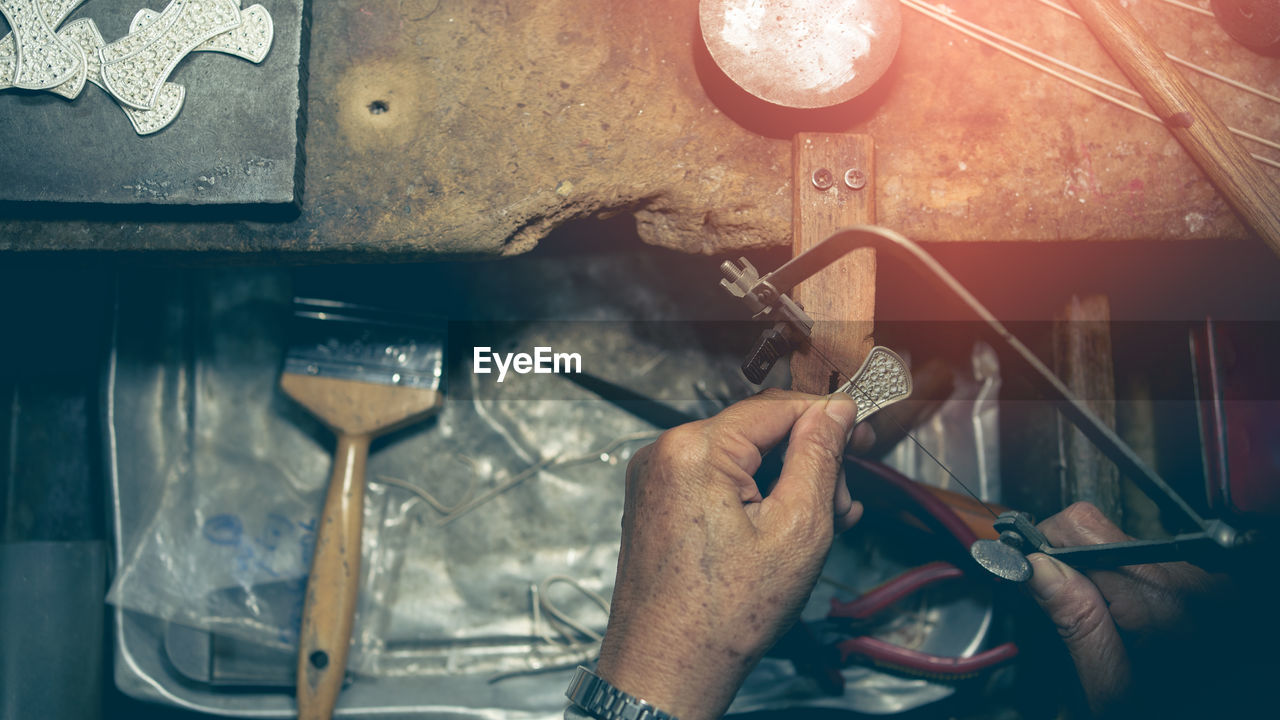 Midsection of man working in machine