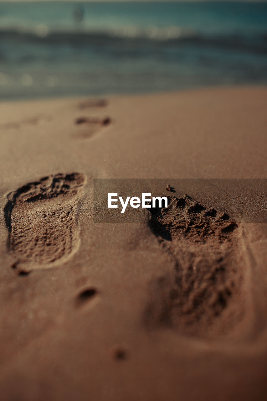 close-up of heart shape on sand