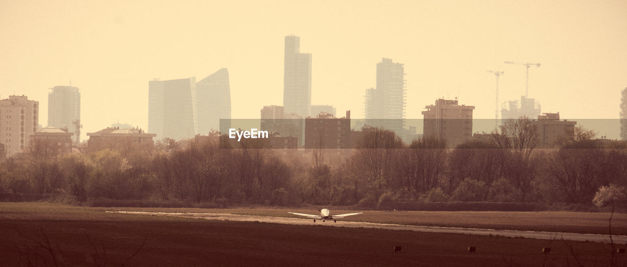 CITY BUILDINGS AGAINST SKY