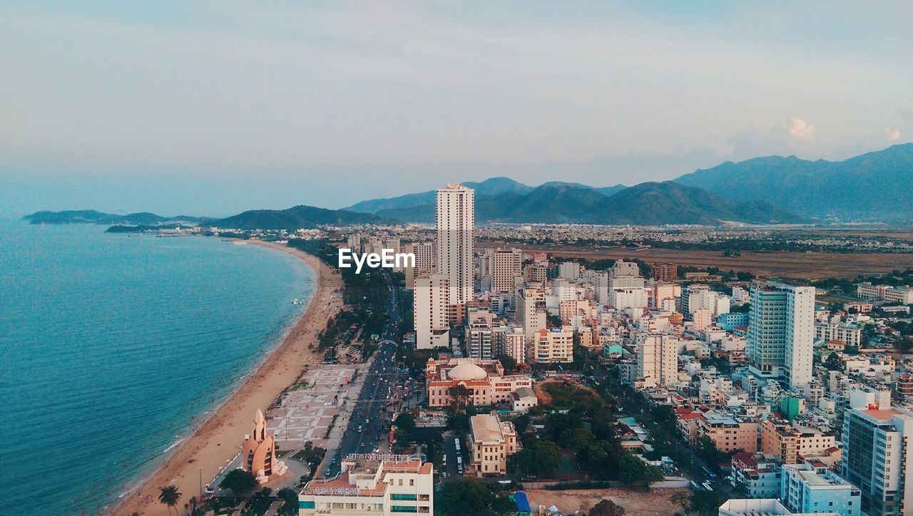 Cityscape view with mountain range in background