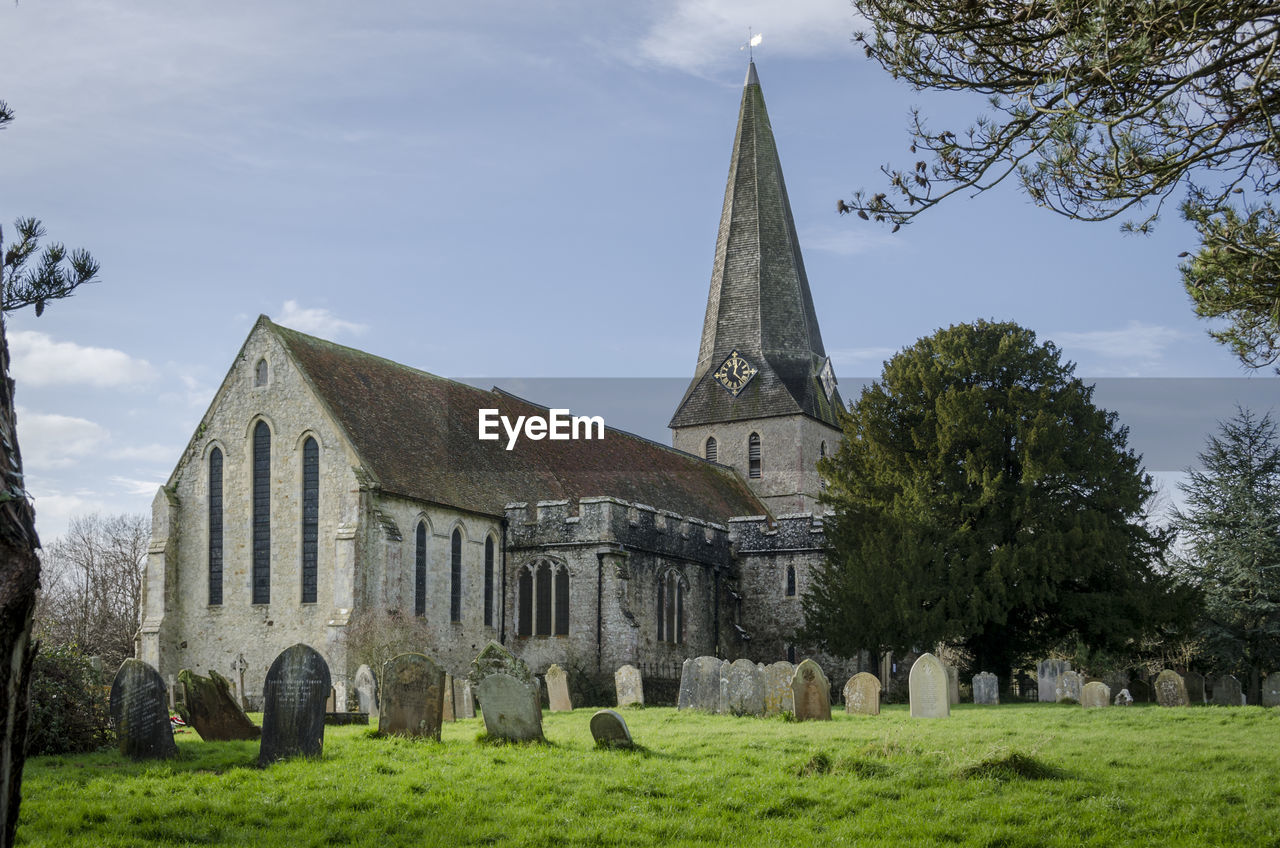 The church of all saints in the village of woodchurch, kent, uk