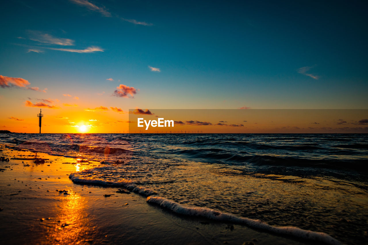 SCENIC VIEW OF SEA DURING SUNSET