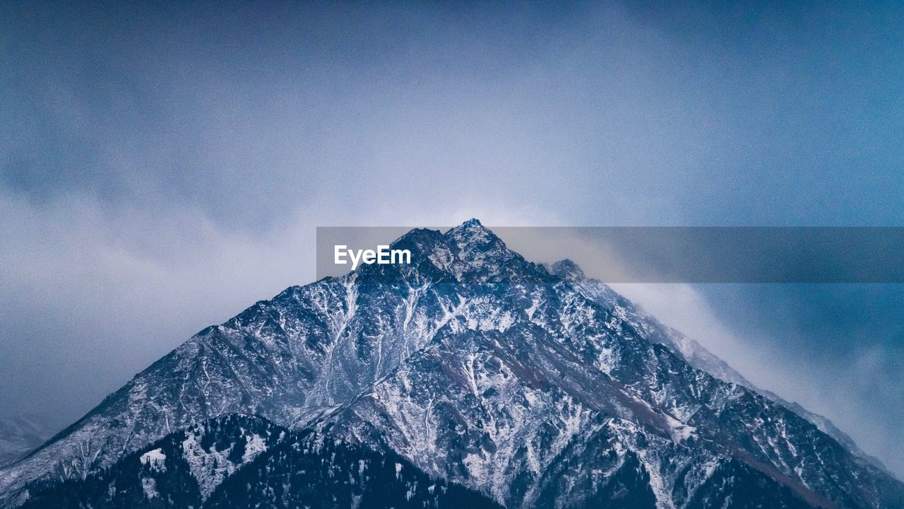 Scenic view of mountain against sky during winter