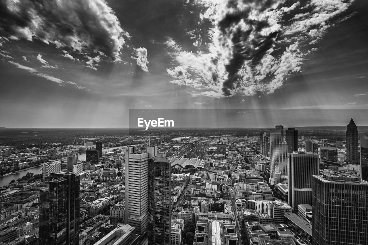 High angle view of buildings in city against sky