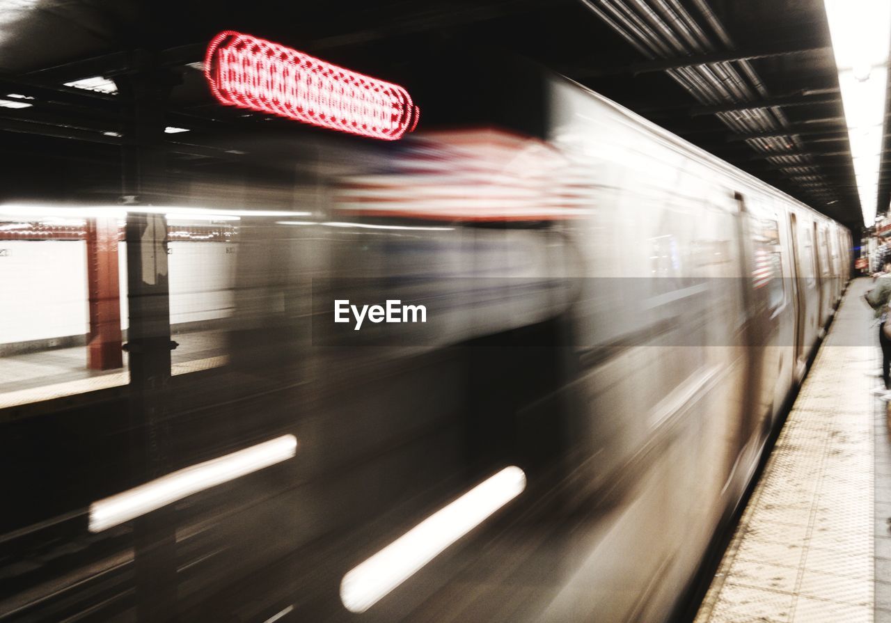 Blurred motion of train at subway station