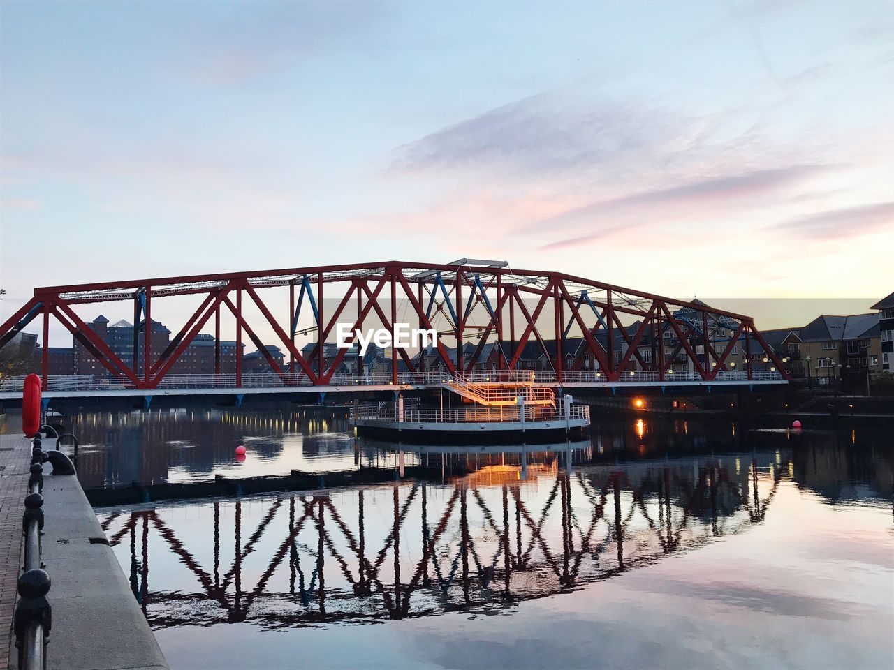 Metallic bridge against sky during winter