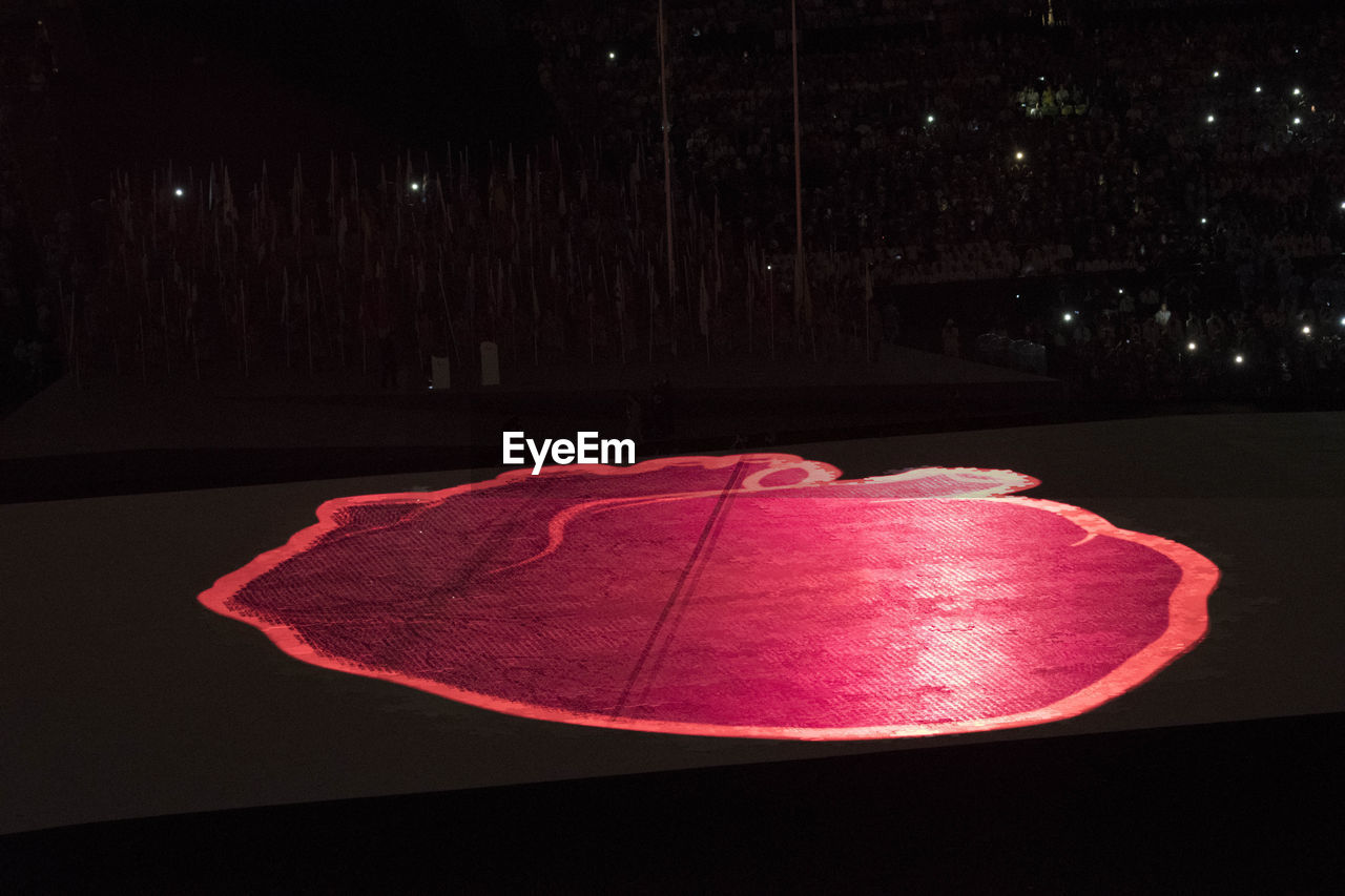 CLOSE-UP VIEW OF ILLUMINATED RED LIGHTS