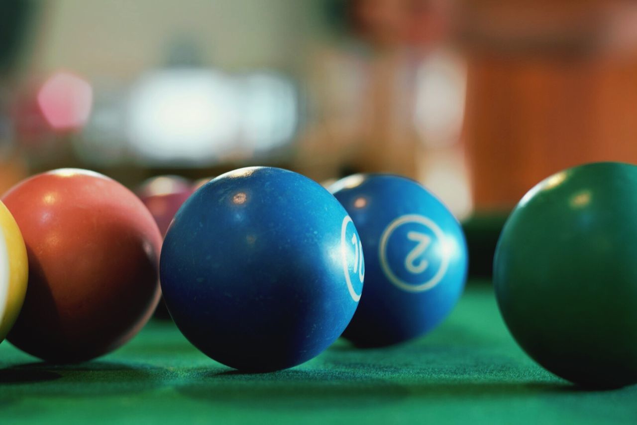 Close-up of balls on cue table