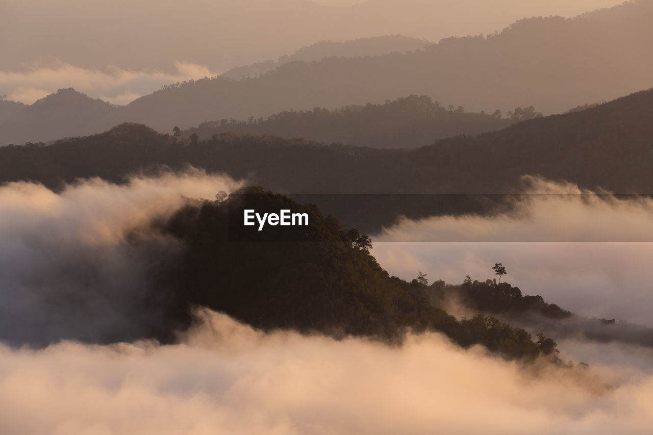 Scenic view of silhouette mountains against sky during sunset