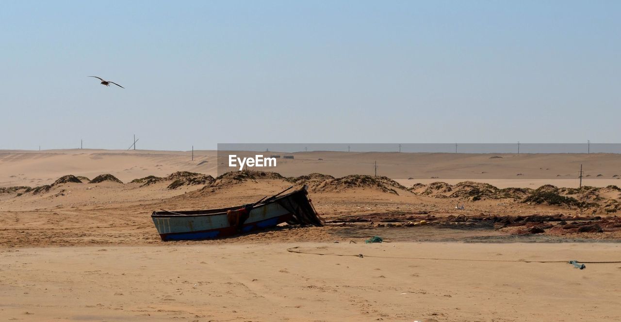 Abandoned boat at beach