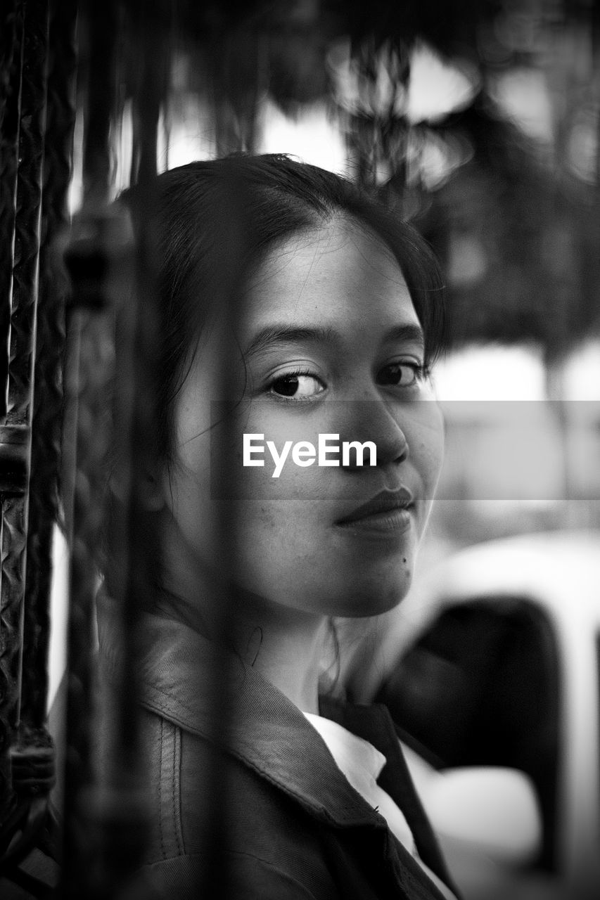 Portrait of a young woman looking away