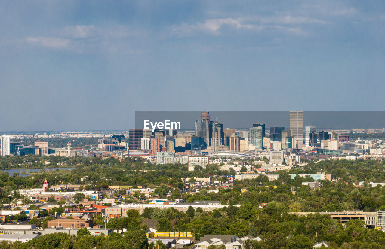 high angle view of buildings in city against sky
