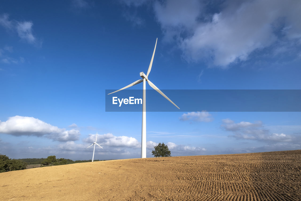 Wind turbine in agricultural fields in the province of tarragona in catalonia spain