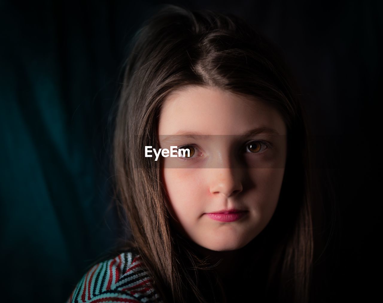 Close-up portrait of girl with brown hair and eyes