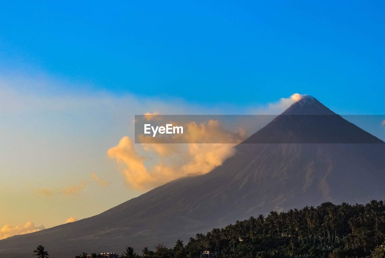 Scenic view of volcanic mountain against sky