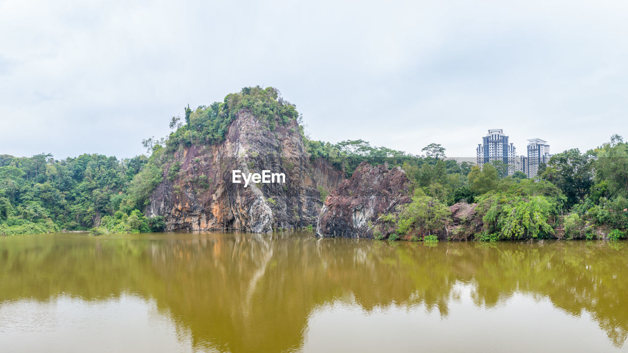 SCENIC VIEW OF LAKE AGAINST TREES