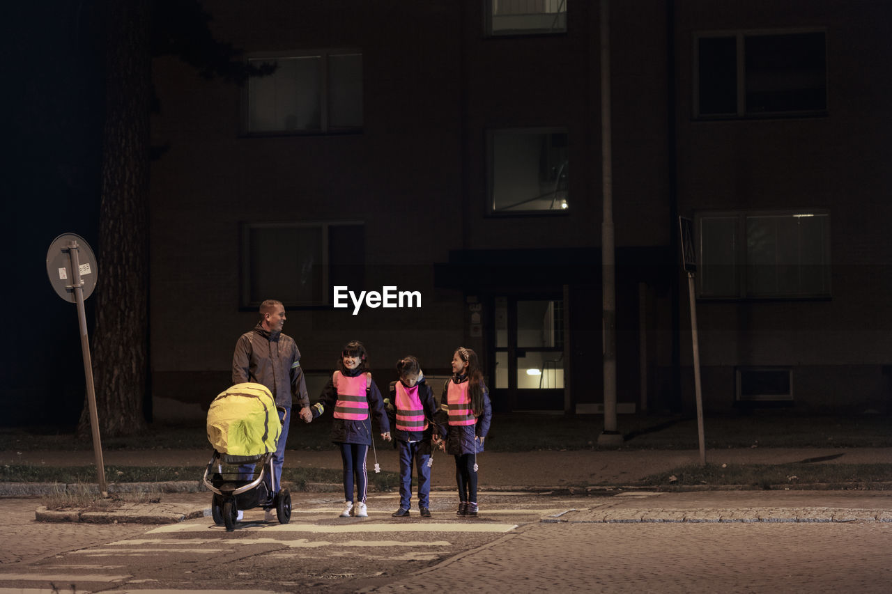 Father with children walking at evening