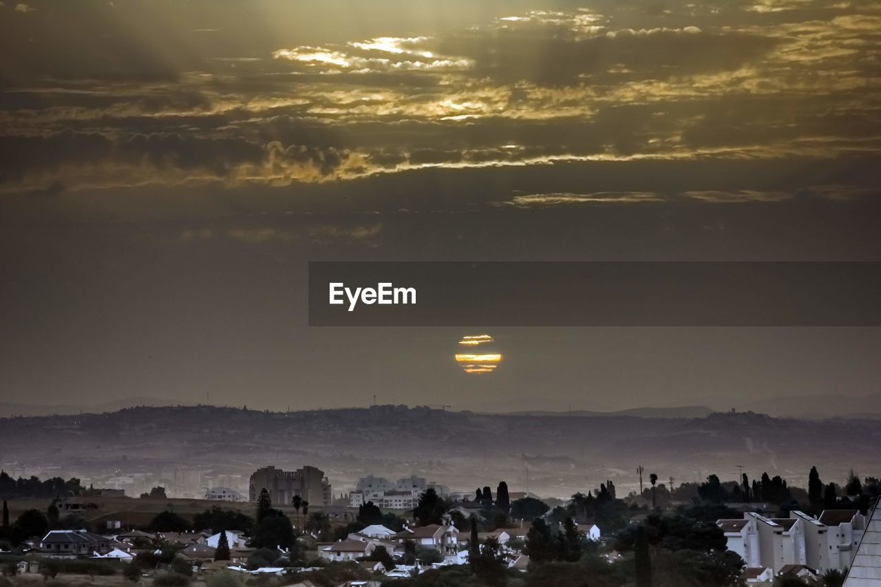 AERIAL VIEW OF CITY DURING SUNSET