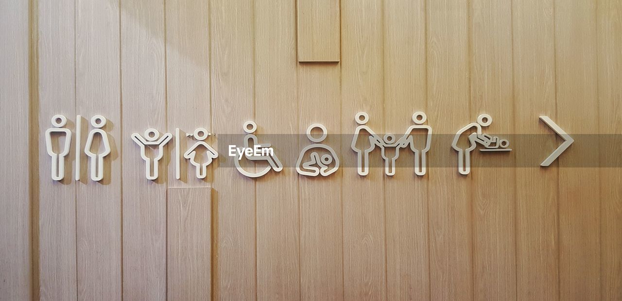 CLOSE-UP OF TEXT ON METAL WOOD