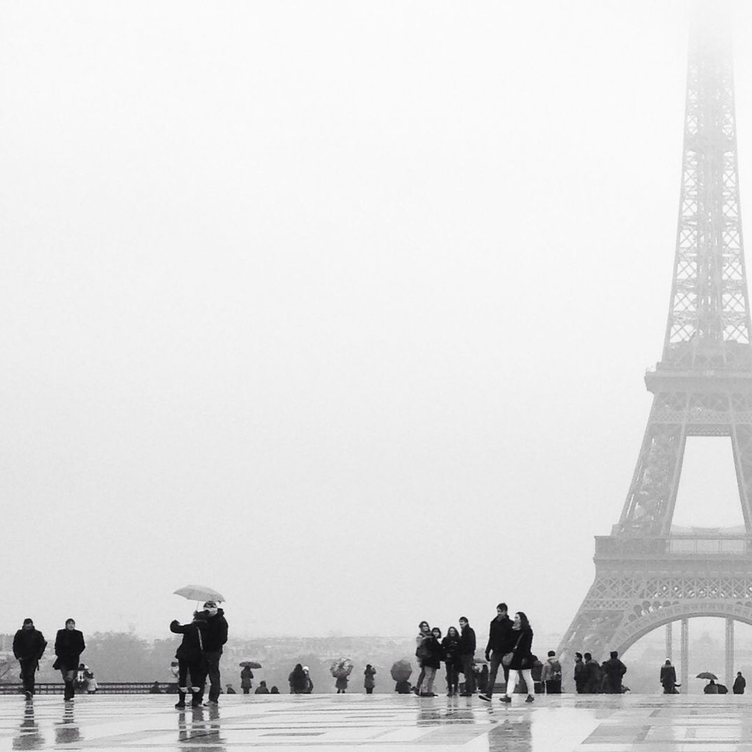 Group of people in front of eiffel tower