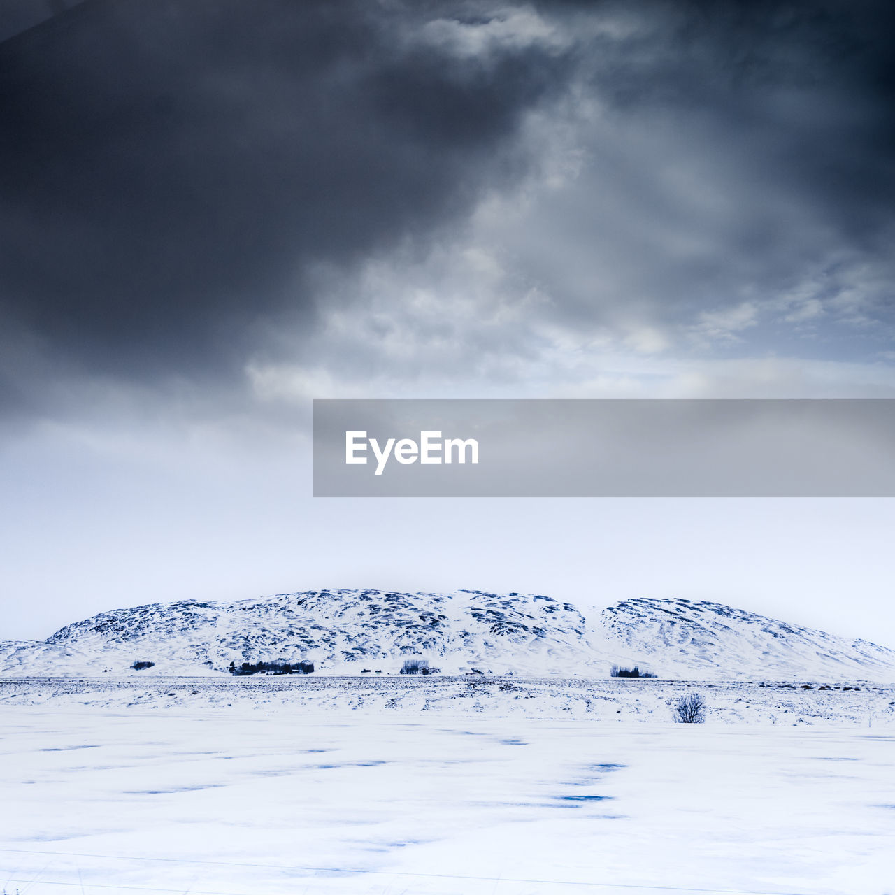 Scenic view of snow covered landscape against sky