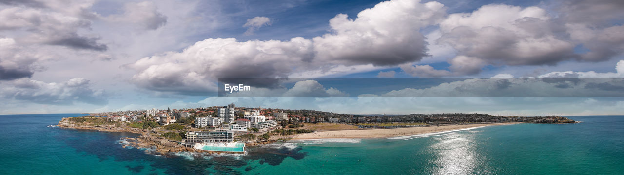 PANORAMIC VIEW OF SEA AND CITY AGAINST SKY