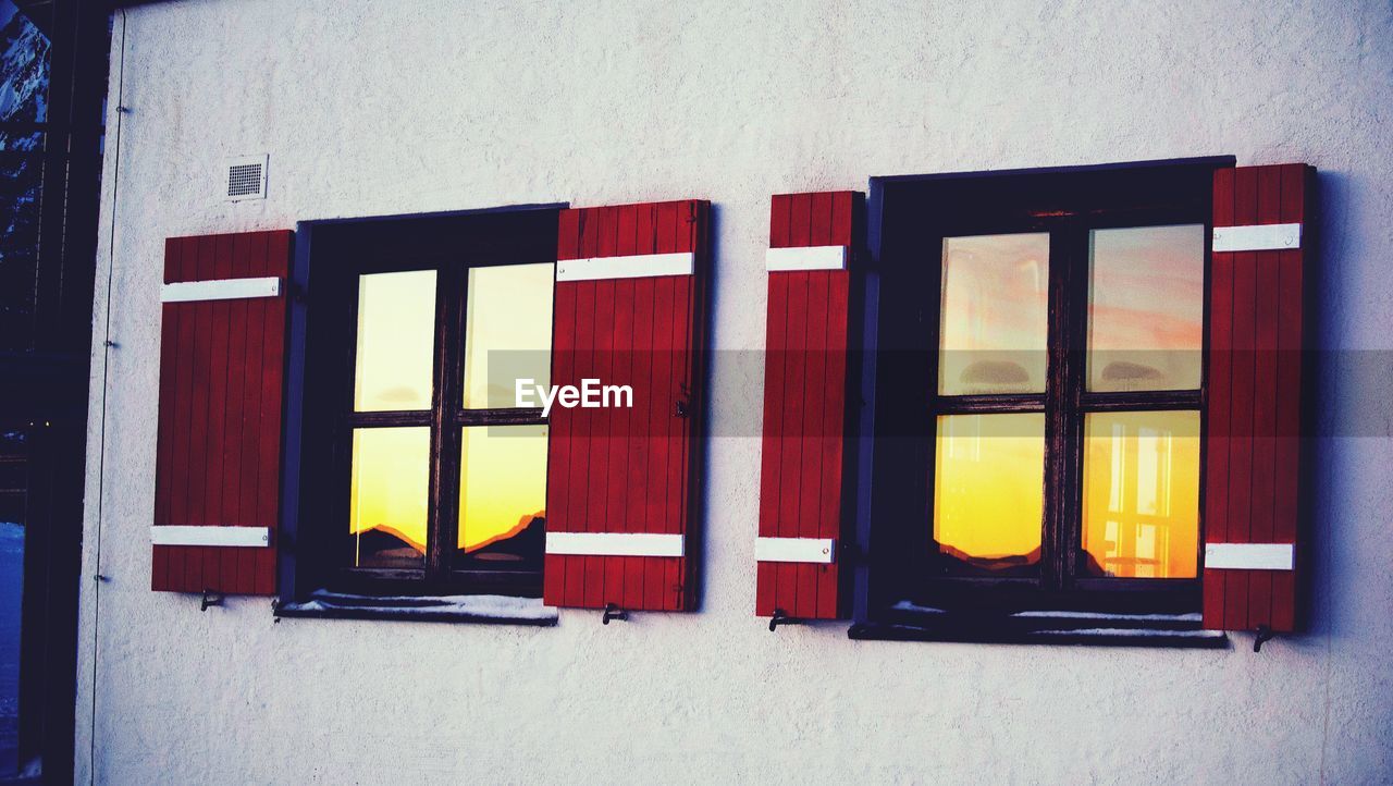 Open window of house at sunset