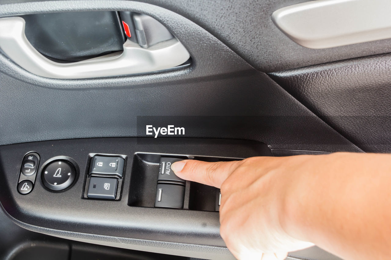 Close-up of man driving car