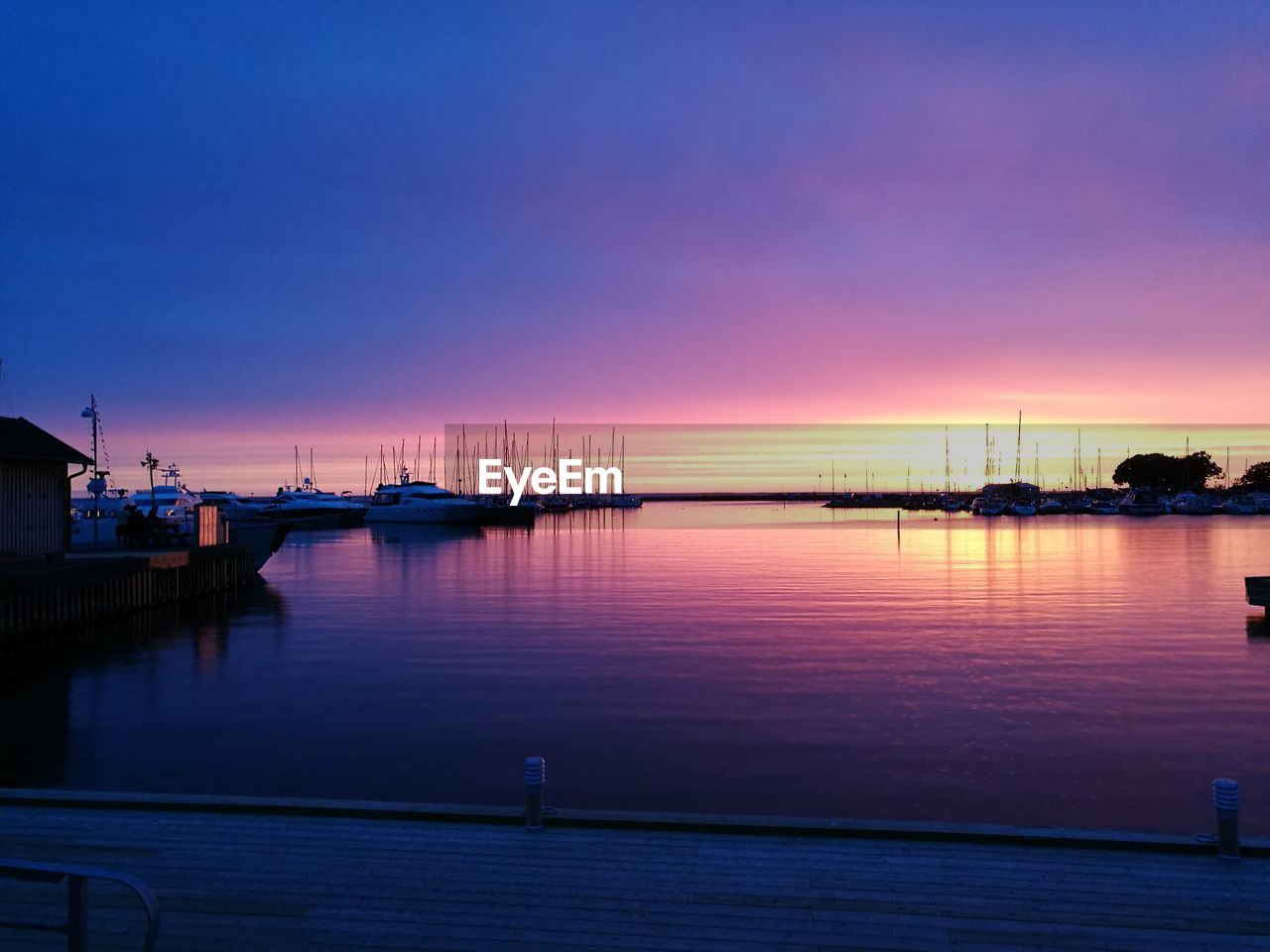 View of harbor at sunset