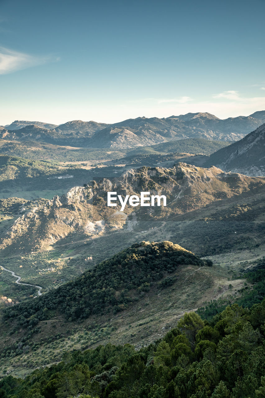 Scenics of mountains against blue sky