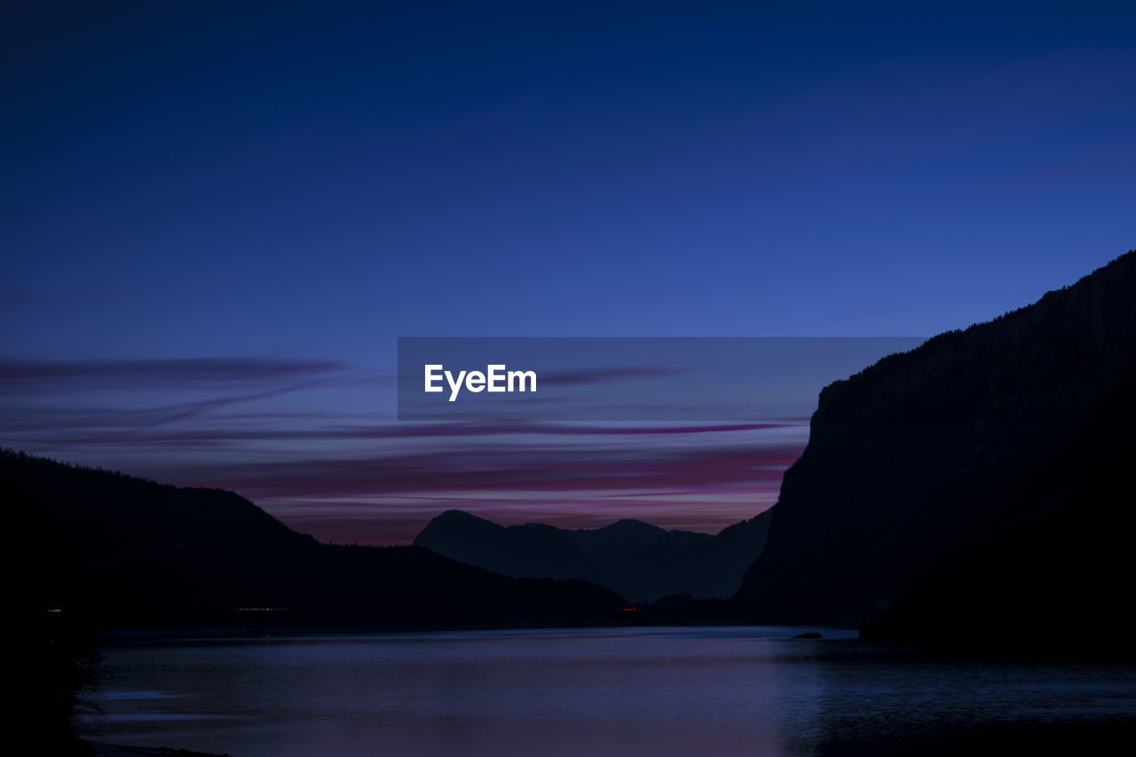 Scenic view of sea against romantic sky at sunset