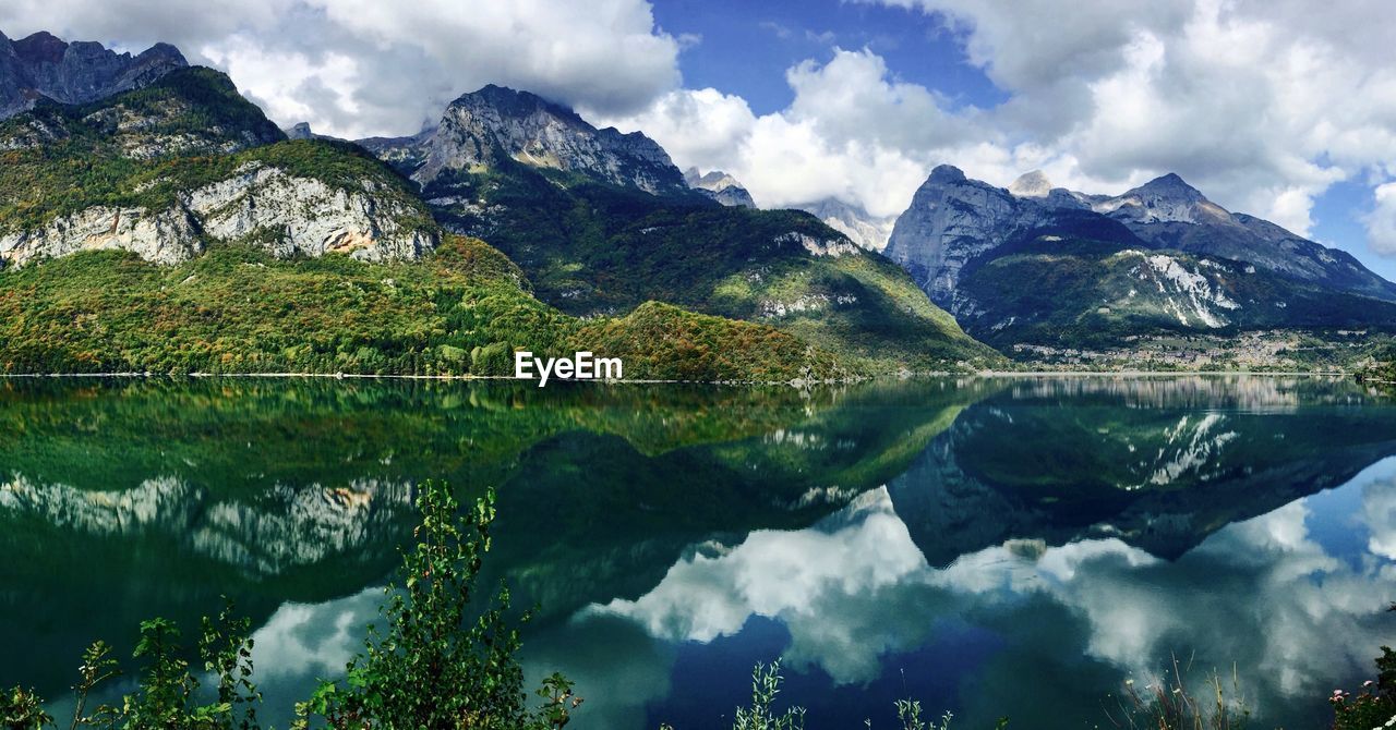 Scenic view of lake and mountains against sky