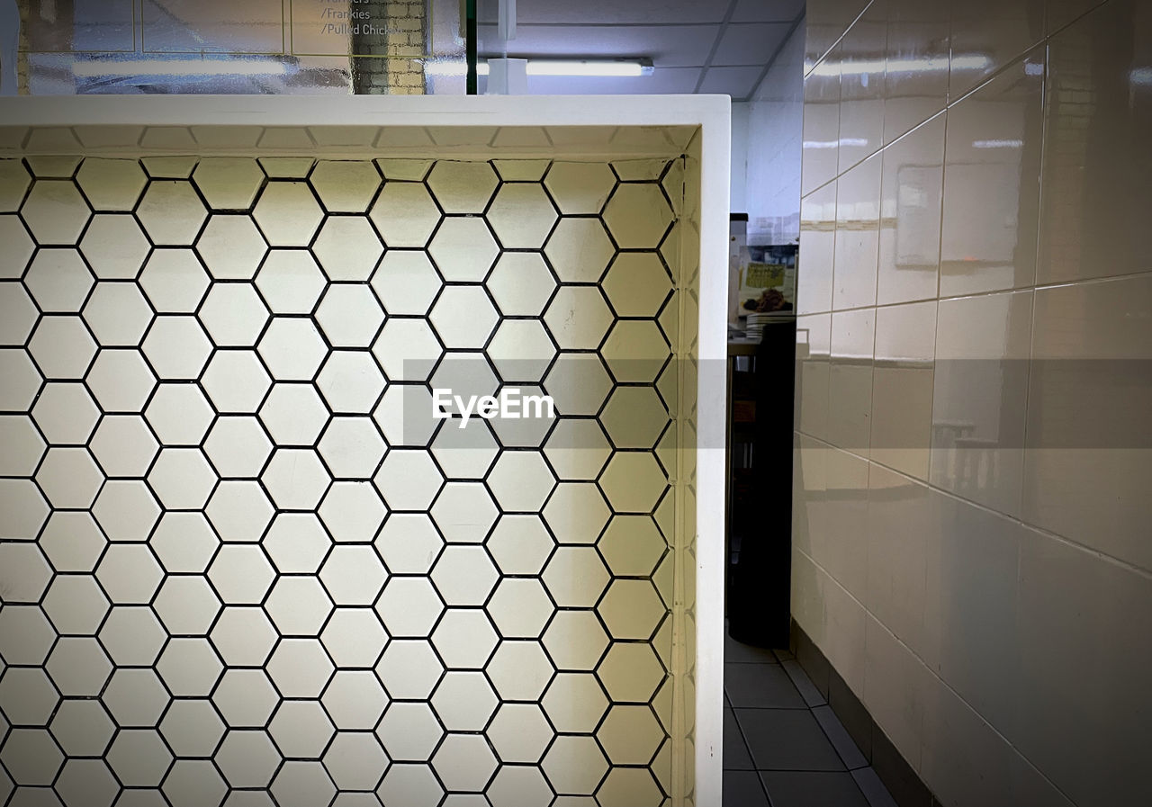 wall, interior design, indoors, floor, architecture, light, no people, flooring, technology, built structure, pattern, window covering, metal, building, tile