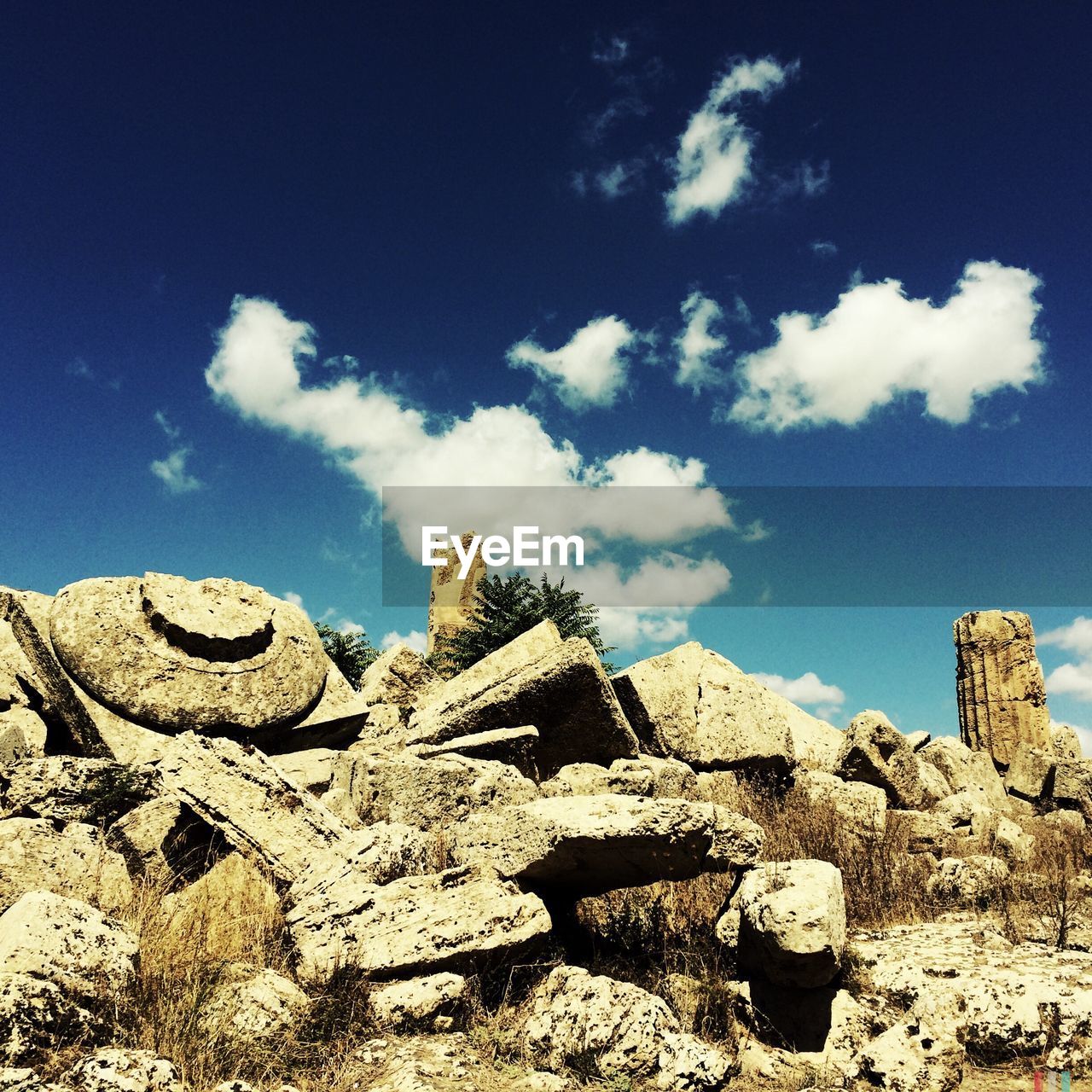 Low angle view of old ruin against blue sky