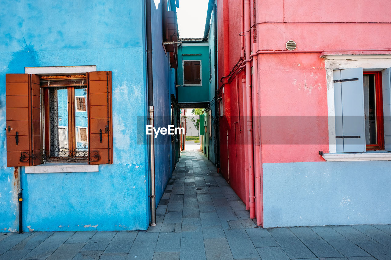 Alley amidst buildings in city