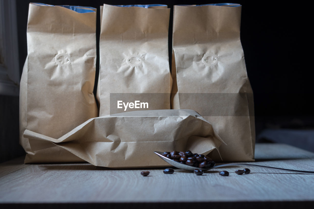 Close-up of paper bags on table