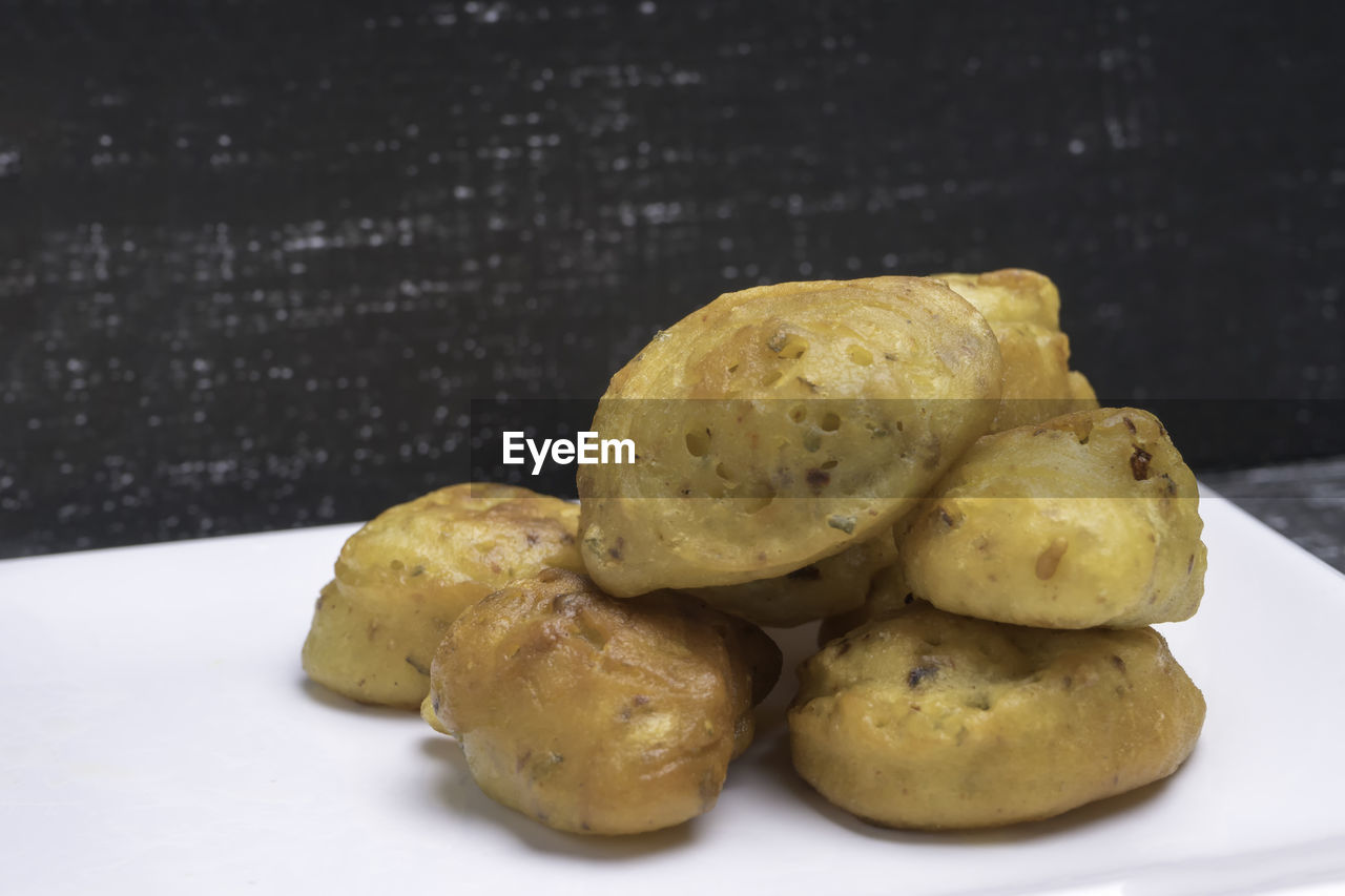 Close up shot of a crunchy cucur ikan bilis or anchovies fritters a malay traditional evening dish.