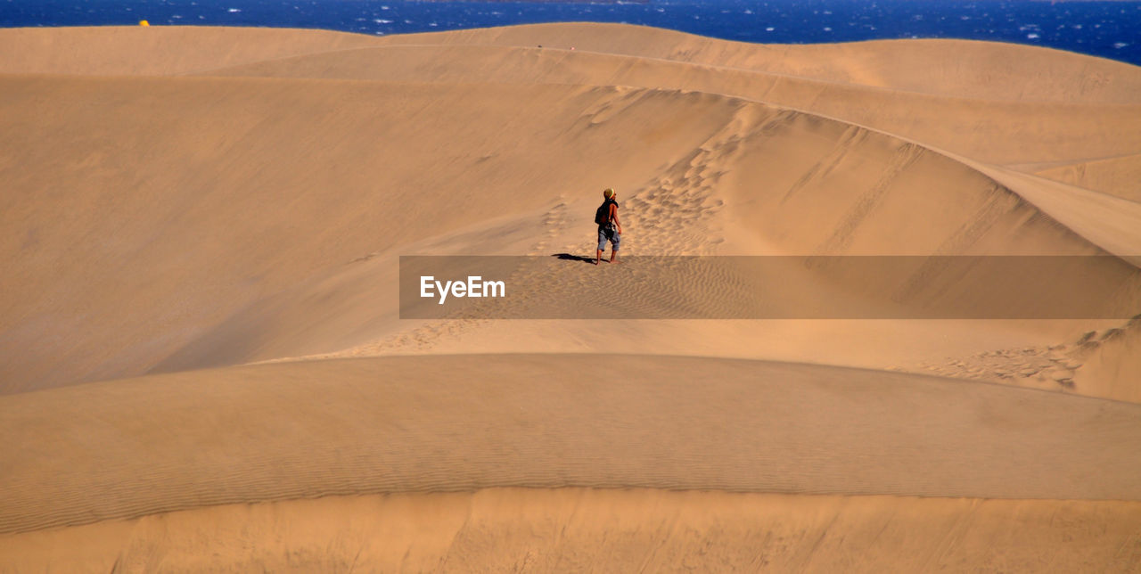 Man walking on desert