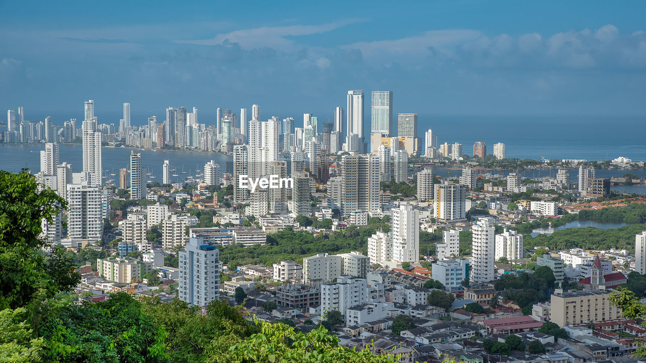 Modern buildings in city against sky