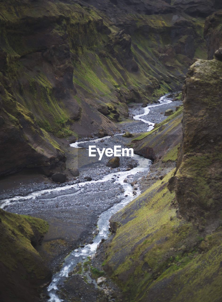 Scenic view of waterfall against sky