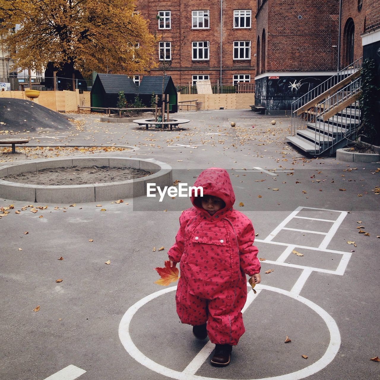 High angle view of girl waking in playground