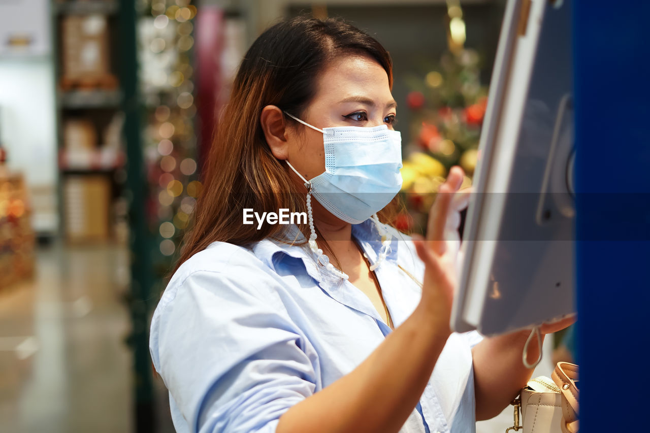 Portrait of woman working at store