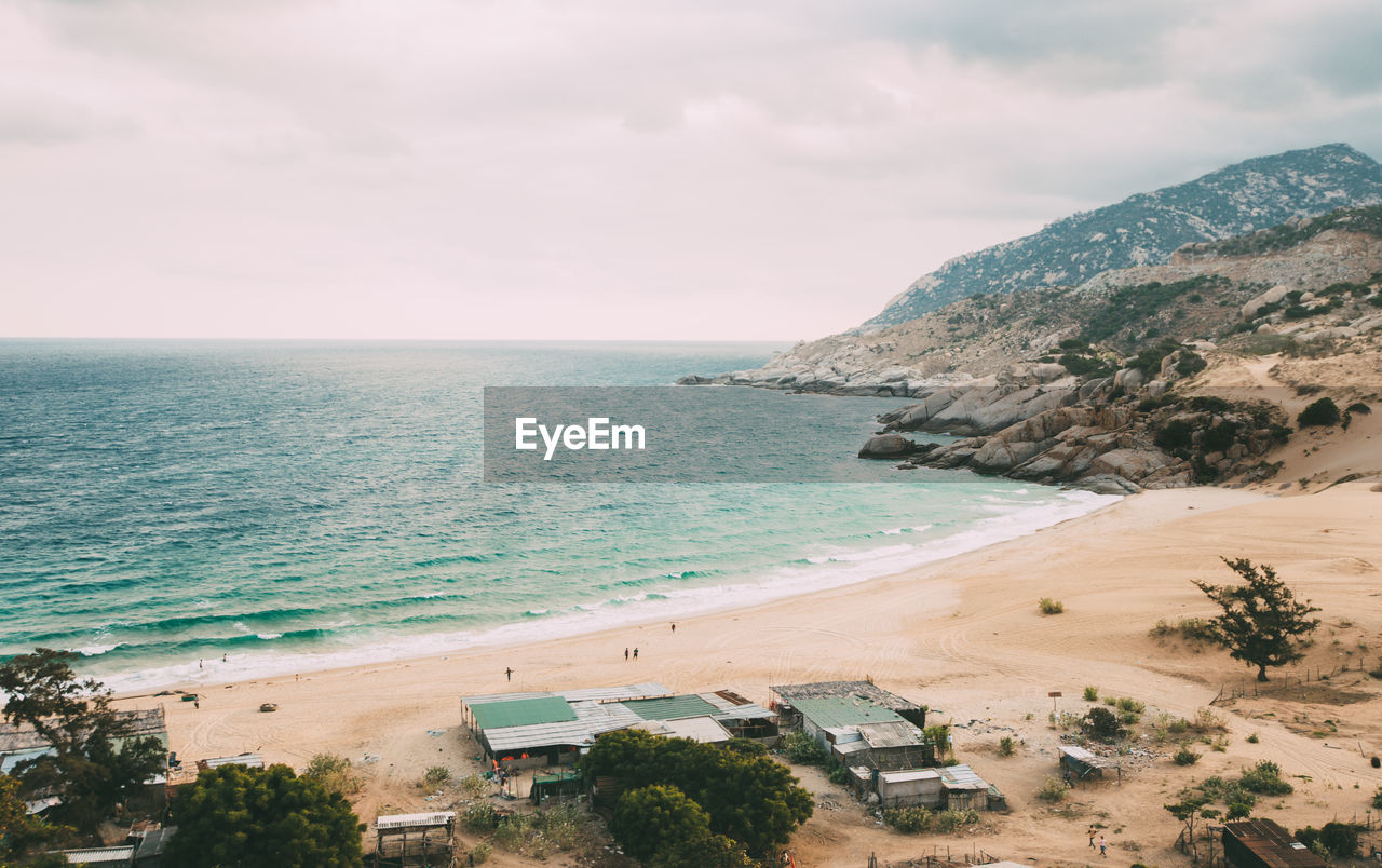 SCENIC VIEW OF SEA AND BEACH AGAINST SKY