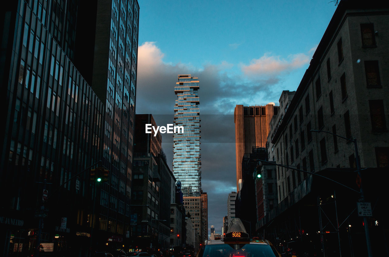 Panoramic view of buildings in city against sky