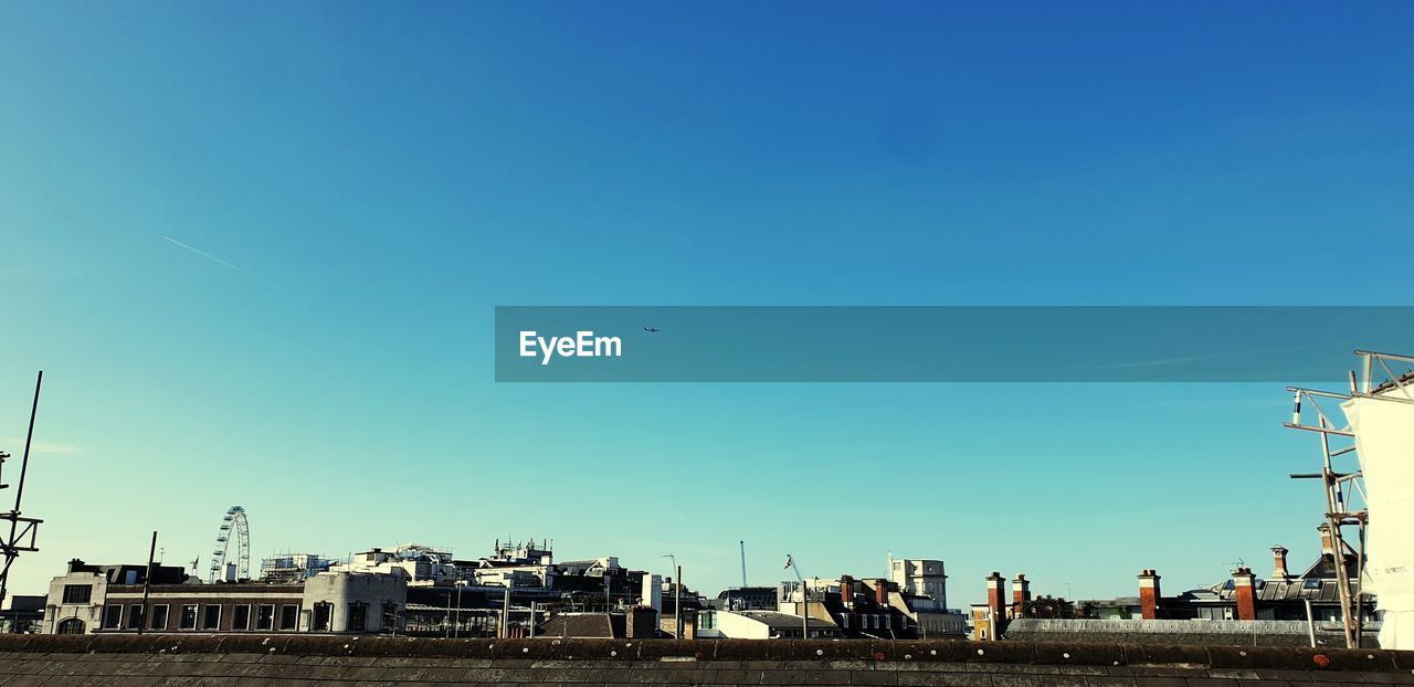 VIEW OF BUILDINGS AGAINST BLUE SKY