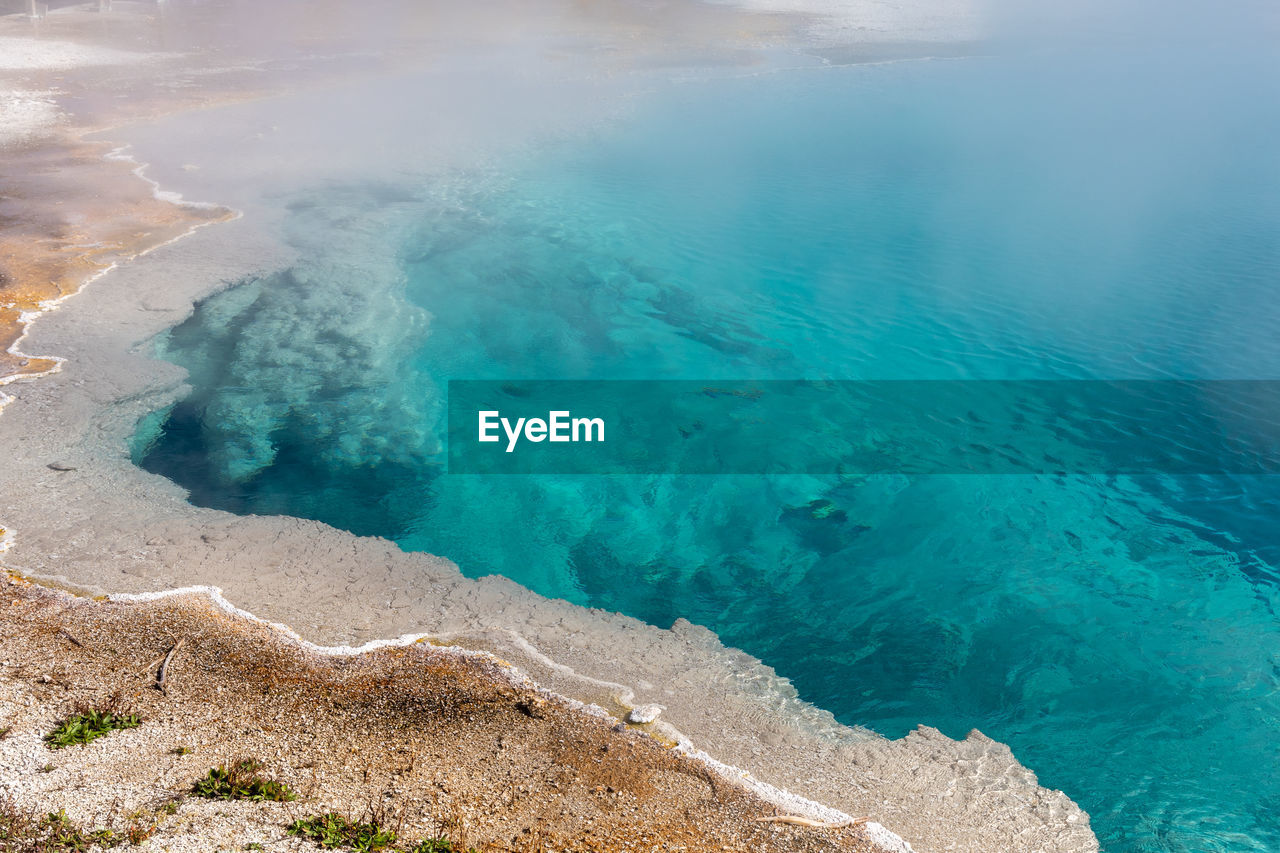 Brilliant blue thermal pool in west thumb basin in yellowstone national park