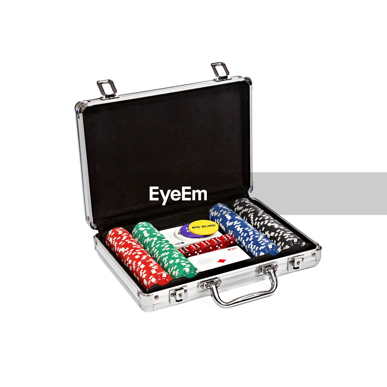 Close-up of gambling chips in suitcase against white background