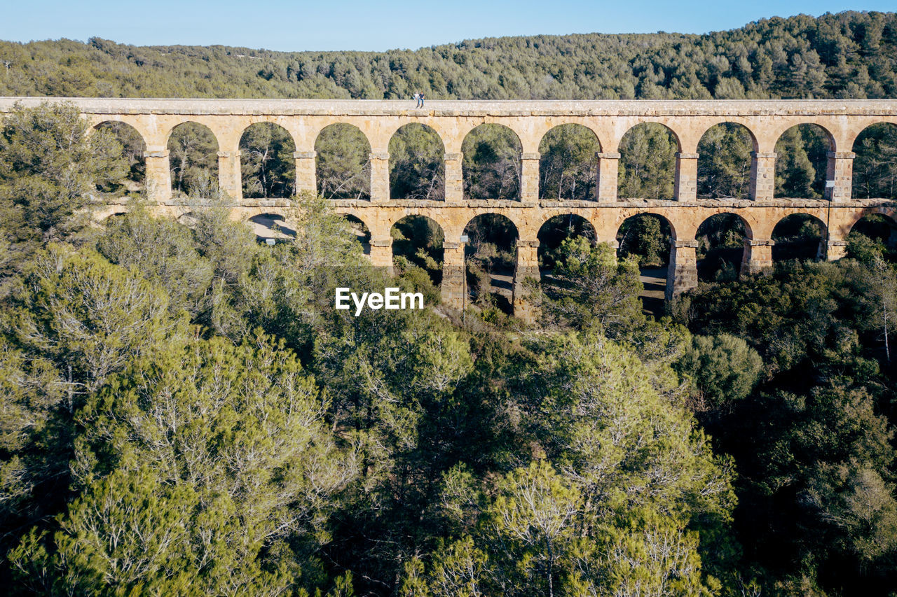 High angle view of les ferreres aqueduct against clear sky
