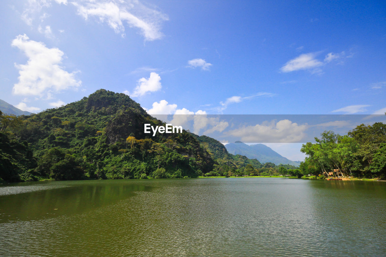 Scenic view of lake against cloudy sky